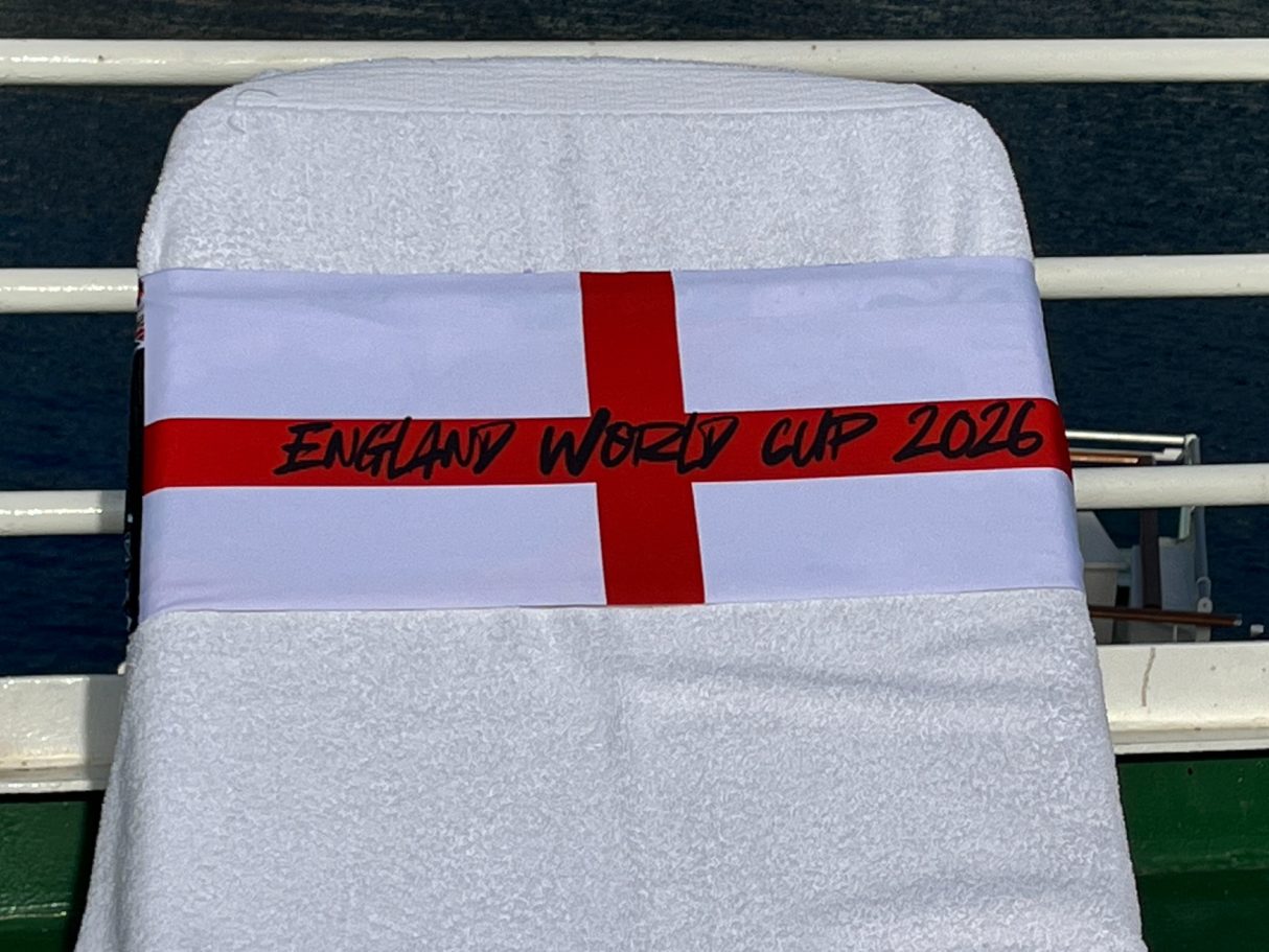 The English National flag holding a towel onto a sun lounger. see tcboo.shop